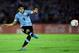 MONTEVIDEO, URUGUAY - NOVEMBER 20: Luis Suarez of Uruguay runs with the ball during leg 2 of the FIFA World Cup Qualifier match between Uruguay and Jordan at Centenario Stadium Stadium on November 20, 2013 in Montevideo, Uruguay. (Photo by Friedemann Vo