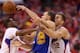 LOS ANGELES, CA - MAY 03: Stephen Curry #30 of the Golden State Warriors tries to pass the ball between Chris Paul #3 and Blake Griffin #32 of the Los Angeles Clippers in Game Seven of the Western Conference Quarterfinals during the 2014 NBA Playoffs at