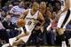 May 6, 2014; San Antonio, TX, USA; San Antonio Spurs guard Tony Parker (9) moves the ball against the defense of Portland Trail Blazers guard Damian Lillard (0) in game one of the second round of the 2014 NBA Playoffs at AT&T Center. Mandatory Credit: Soo