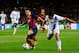 BARCELONA, SPAIN - MARCH 12: Lionel Messi of Barcelona is challenged by Sergio Aguero of Manchester City during the UEFA Champions League Round of 16, second leg match between FC Barcelona and Manchester City at Camp Nou on March 12, 2014 in Barcelona,