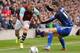 BURNLEY, ENGLAND - APRIL 12: Burnley's Kieran Trippier (L) gets past Middlesbrough's Emanuel Ledesma during the Sky Bet Championship match between Burnley and Middlesbrough at Turf Moor on April 12, 2014 in Burnley, England. (Photo by Dave Thompson/Getty