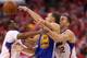 LOS ANGELES, CA - MAY 03: Stephen Curry #30 of the Golden State Warriors tries to pass the ball between Chris Paul #3 and Blake Griffin #32 of the Los Angeles Clippers in Game Seven of the Western Conference Quarterfinals during the 2014 NBA Playoffs at