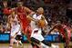 Apr 25, 2014; Portland, OR, USA; Portland Trail Blazers guard Damian Lillard (0) is bumped by Houston Rockets center Dwight Howard (12) during the second quarter in game three of the first round of the 2014 NBA Playoffs at the Moda Center. Mandatory Credi