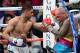 LAS VEGAS, NV - MAY 03: Amir Khan (L) hits Luis Collazo in the 10th round of their welterweight bout at the MGM Grand Garden Arena on May 3, 2014 in Las Vegas, Nevada. Khan won by unanimous decision. (Photo by Ethan Miller/Getty Images)