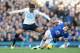 LIVERPOOL, ENGLAND - NOVEMBER 03: Seamus Coleman of Everton tackled by Paulinho of Tottenham Hotspur during the Barclays Premier League match between Everton and Tottenham Hotspur at Goodison Park on November 3, 2013 in Liverpool, England. (Photo by Ton