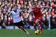 LONDON, ENGLAND - FEBRUARY 01: Luke Shaw of Southampton in action against Lewis Holtby of Fulham during the Barclays Premier League match between Fulham and Southampton at Craven Cottage on February 1, 2014 in London, England. (Photo by Ian Walton/Getty