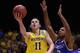 INDIANAPOLIS, IN - MARCH 30: Nik Stauskas #11 of the Michigan Wolverines shoots the ball against Aaron Harrison #2 of the Kentucky Wildcats during the midwest regional final of the 2014 NCAA Men's Basketball Tournament at Lucas Oil Stadium on March 30, 2