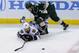 ST PAUL, MN - MAY 6: Brandon Bollig #52 of the Chicago Blackhawks and Keith Ballard #2 of the Minnesota Wild watch the puck during the third period in Game Three of the Second Round of the 2014 NHL Stanley Cup Playoffs on May 6, 2014 at Xcel Energy Center