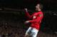 MANCHESTER, ENGLAND - MAY 06: Robin van Persie of Manchester United celebrates scoring his team's third goal during the Barclays Premier League match between Manchester United and Hull City at Old Trafford on May 6, 2014 in Manchester, England. (Photo b