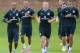 ST ALBANS, ENGLAND - AUGUST 13: Ashley Young, Tom Cleverley and Jack Rodwell of England warm up with their team-mates during England Training session at London Colney on August 13, 2012 in St Albans, England. (Photo by Tom Dulat/Getty Images)