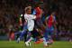 LONDON, ENGLAND - MAY 05: Glen Johnson of Liverpool and Yannick Bolasie of Crystal Palace compete for the ball during the Barclays Premier League match between Crystal Palace and Liverpool at Selhurst Park on May 5, 2014 in London, England. (Photo by Cl
