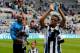 NEWCASTLE, ENGLAND- May 03: Loic Remy (R) and Shola Ameobi (L) of Newcastle during a lap of honour after the Barclays Premier League match between Newcastle United and Cardiff City at St. James' Park on May 03, 2014 in Newcastle upon Tyne, England. (Ph