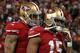 SAN FRANCISCO, CA - JANUARY 12: Quarterback Colin Kaepernick #7 talks with Wide receiver Michael Crabtree #15 of the San Francisco 49ers after scoring a touchdown in the second quarter against the Green Bay Packers during the NFC Divisional Playoff Game