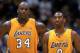 LOS ANGELES - APRIL 17: Shaquille O'Neal #34 and Kobe Bryant #8 of the Los Angeles Lakers wait for play to resume in Game One of the Western Conference Quarterfinals against the Houston Rockets during the 2004 NBA Playoffs at Staples Center on Aril 17, 2