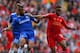 LIVERPOOL, ENGLAND - APRIL 27: Ashley Cole of Chelsea and Raheem Sterling of Liverpool battle for the ball during the Barclays Premier League match between Liverpool and Chelsea at Anfield on April 27, 2014 in Liverpool, England. (Photo by Clive Brunskil