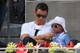 MADRID, SPAIN - MAY 08: Real Madrid footballer Cristiano Ronaldo and his son Cristiano Ronaldo Junior watch Rafael Nadal of Spain against Jarkko Nieminen of Finland in their third round match during day six of the Mutua Madrid Open tennis tournament at t