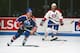 MONTREAL 1980's: Mark Messier #11 of the Edmonton Oilers skates against Larry Robinson #19 of the Montreal Canadiens in the 1980's at the Montreal Forum in Montreal, Quebec, Canada. (Photo by Denis Brodeur/NHLI via Getty Images)