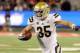 Nov 9, 2013; Tucson, AZ, USA; UCLA Bruins inside linebacker Jordan Zumwalt (35) runs the ball during the second quarter against the Arizona Wildcats at Arizona Stadium. Mandatory Credit: Casey Sapio-USA TODAY Sports
