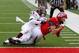 Nov 9, 2013; Salt Lake City, UT, USA; Utah Utes wide receiver Sean Fitzgerald (83) catches the ball and reaches to score a touch down while Utah Utes defensive end Trevor Reilly (9) tries to defend in the third quarter at Rice-Eccles Stadium. Arizona Stat