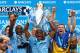 MANCHESTER, ENGLAND - MAY 11: Vincent Kompany of Manchester City lifts the Premier League trophy at the end of the Barclays Premier League match between Manchester City and West Ham United at the Etihad Stadium on May 11, 2014 in Manchester, England. (P