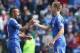 CARDIFF, WALES - MAY 11: Ashley Cole (L) of Chelsea is congratulated by team mate Tomas Calas as he leaves the field after their victory during the Barclays Premier League match between Cardiff City and Chelsea at the Cardiff City Stadium on May 11, 2014