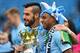 MANCHESTER, ENGLAND - MAY 11: Alvaro Negredo and Fernandinho (R) of Manchester City pose with the trophy at the end of the Barclays Premier League match between Manchester City and West Ham United at the Etihad Stadium on May 11, 2014 in Manchester, Engl