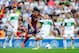 ELCHE, SPAIN - MAY 11: Cesc Fabregas of FC Barcelona is brought down by Carles Gil of Elche FC during the La Liga match between Elche FC and FC Barcelona at Estadio Manuel Martinez Valero on May 11, 2014 in Elche, Spain. (Photo by David Ramos/Getty Imag