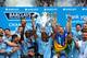 MANCHESTER, ENGLAND - MAY 11: Vincent Kompany of Manchester City lifts the Premier League trophy at the end of the Barclays Premier League match between Manchester City and West Ham United at the Etihad Stadium on May 11, 2014 in Manchester, England. (P