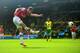 NORWICH, ENGLAND - MAY 11: Aaron Ramsey of Arsenal scores the opening goal during the Barclays Premier League match between Norwich City and Arsenal at Carrow Road on May 11, 2014 in Norwich, England. (Photo by Jamie McDonald/Getty Images)