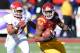 LAS VEGAS, NV - DECEMBER 21: Darreus Rogers #84 of the USC Trojans runs for yardage ahead of Jonathan Norton #37 of the Fresno State Bulldogs during the Royal Purple Las Vegas Bowl at Sam Boyd Stadium on December 21, 2013 in Las Vegas, Nevada. USC won 45