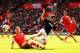 SOUTHAMPTON, ENGLAND - MAY 11: Robin van Persie (R) of Manchester United is tackled by Luke Shaw (L) of Southampton during the Barclays Premier League match between Southampton and Manchester United at St Mary's Stadium on May 11, 2014 in Southampton, En