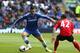CARDIFF, WALES - MAY 11: Fernando Torres of Chelsea takes on Declan John during the Barclays Premier League match between Cardiff City and Chelsea at the Cardiff City Stadium on May 11, 2014 in Cardiff, Wales. (Photo by David Rogers/Getty Images)
