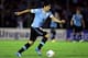MONTEVIDEO, URUGUAY - NOVEMBER 20: Luis Suarez of Uruguay runs with the ball during leg 2 of the FIFA World Cup Qualifier match between Uruguay and Jordan at Centenario Stadium Stadium on November 20, 2013 in Montevideo, Uruguay. (Photo by Friedemann Vo