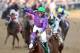 LOUISVILLE, KY - MAY 03: Jockey Victor Espinoza celebrates atop of California Chrome #5 after crossing the finish line to win the 140th running of the Kentucky Derby at Churchill Downs on May 3, 2014 in Louisville, Kentucky. (Photo by Matthew Stockman/G