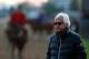 LOUISVILLE, KY - MAY 01: Bob Baffert, trainer of Kentucky Derby contenders Hoppertunity and Chitu, watches track activity during early morning workouts at Churchill Downs on May 1, 2014 in Louisville, Kentucky. (Photo by Kevin C. Cox/Getty Images)