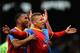 LONDON, ENGLAND - MAY 11: Dwight Gayle (R) of Crystal Palace celebrates scoring his second goal during the Barclays Premier League match between Fulham and Crystal Palace at Craven Cottage on May 11, 2014 in London, England. (Photo by Christopher Lee/Ge
