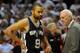 PORTLAND, OR - MAY 12: Tony Parker #9 of the San Antonio Spurs speaks with head coach Gregg Popovich of the San Antonio Spurs in the first quarter of Game Four of the Western Conference Semifinals against the Portland Trail Blazers during the 2014 NBA Pla