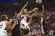 May 12, 2014; Portland, OR, USA; Portland Trail Blazers guard Damian Lillard (0) shoots between San Antonio Spurs forward Tim Duncan (21) and Spurs forward Kawhi Leonard (2) in the first half of game four of the second round of the 2014 NBA Playoffs at th