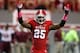 RALEIGH, NC - OCTOBER 06: Dontae Johnson #25 of the North Carolina State Wolfpack reacts to the crowd during their game against the Florida State Seminoles at Carter-Finley Stadium on October 6, 2012 in Raleigh, North Carolina. (Photo by Streeter Lecka/