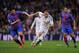 MADRID, SPAIN - MARCH 09: Karim Benzema (R) of Real Madrid CF is challenged by David Navarro of Levante UD during the La Liga match between Real Madrid CF and Levante UD at Santiago Bernabeu stadium on March 9, 2014 in Madrid, Spain. (Photo by Denis Doy