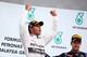 KUALA LUMPUR, MALAYSIA - MARCH 30: Race winner Lewis Hamilton of Great Britain and Mercedes GP (L) celebrates on the podium alongside third placed Sebastian Vettel of Germany and Infiniti Red Bull Racing after the Malaysia Formula One Grand Prix at the S