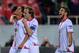SEVILLE, SPAIN - APRIL 24: Carlos Bacca (L) of Sevilla FC celebrates with Ivan Rakitic and Daniel Carrico after scoring Sevilla's 2nd goal during the UEFA Europa League Semi Final first leg match between Sevilla FC and Valencia CF at Estadio Ramon Sanche