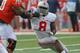 CHAMPAIGN, IL - NOVEMBER 16: Noah Spence #8 of the Ohio State Buckeyes rushes against Corey lewis #70 of the Illinois Fighting Illini at Memorial Stadium on November 16, 2013 in Champaign, Illinois. Ohio State defeated Illinois 60-35. (Photo by Jonathan
