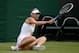 LONDON, ENGLAND - JUNE 26: Maria Sharapova of Russia slips during her Ladies' Singles second round match against Michelle Larcher de Brito of Portugal on day three of the Wimbledon Lawn Tennis Championships at the All England Lawn Tennis and Croquet Club