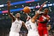 NEW YORK, NY - MAY 12: Mario Chalmers #15 of the Miami Heat passes the ball as Paul Pierce #34 and Kevin Garnett #2 of the Brooklyn Nets defend in Game Four of the Eastern Conference Semifinals during the 2014 NBA Playoffs at the Barclays Center on May 1