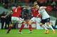 LONDON, ENGLAND - MARCH 05: Jack Wilshere of England takes on Daniel Agger of Denmark during the International Friendly match between England and Denmark at Wembley Stadium on March 5, 2014 in London, England. (Photo by Richard Heathcote/Getty Images)