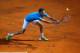 ROME, ITALY - MAY 14: Gilles Simon of France in action against Rafael Nadal of Spain during day four of the Internazionali BNL d'Italia tennis 2014 on May 14, 2014 in Rome, Italy. (Photo by Julian Finney/Getty Images)