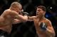 Mar 16, 2013; Montreal, Quebec, CAN; Nick Diaz (blue) lands a punch on Georges St.Pierre (red) during their Welterweight title bout at UFC 158 at the Bell Centre. Mandatory Credit: Eric Bolte-USA TODAY Sports