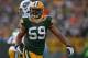 GREEN BAY, WI - DECEMBER 23: Brad Jones #59 of the Green Bay Packers celebrates a play against the Tennessee Titans at Lambeau Field on December 23, 2012 in Green Bay, Wisconsin. The Packers defeated the Titans 55-7. (Photo by Jonathan Daniel/Getty Imag