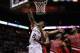 May 14, 2014; San Antonio, TX, USA; San Antonio Spurs forward Kawhi Leonard (2) reaches for a rebound with Portland Trail Blazers center Robin Lopez (behind) in game five of the second round of the 2014 NBA Playoffs at AT&T Center. Mandatory Credit: Soobu